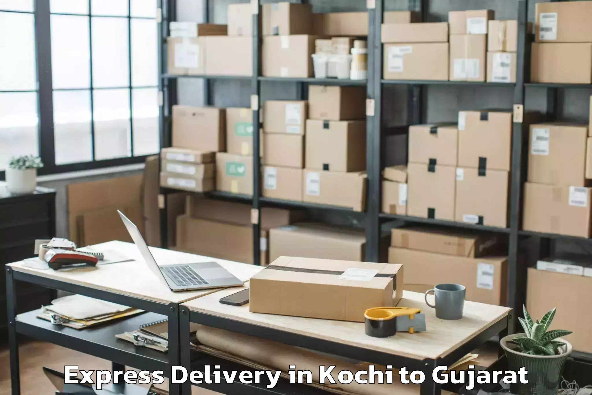 Discover Kochi to Madhavpur Express Delivery